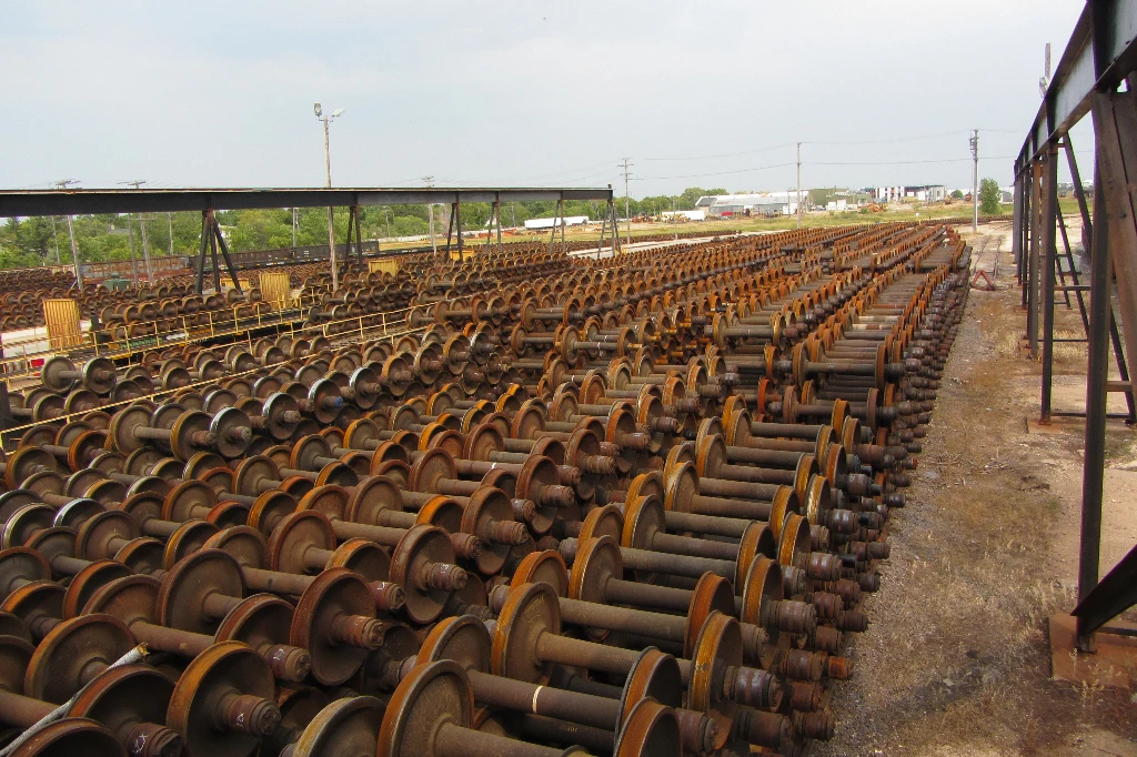 Heavy equipment for dismount, axle wash, CNC lathe, and remount of railroad wheelsets. PLC upgrades from relay logic.